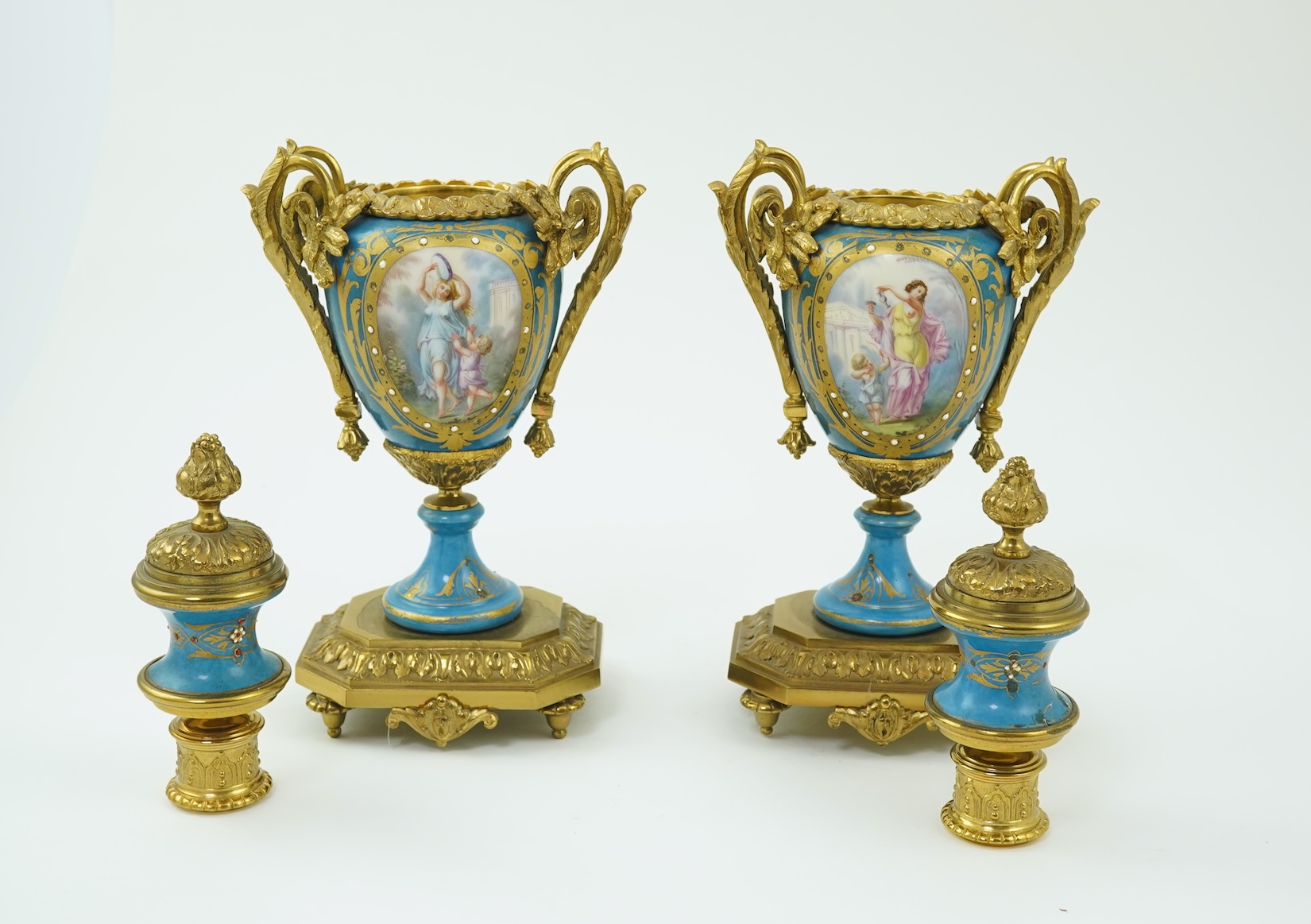 A pair of late 19th century ormolu mounted Sevres style porcelain cassolettes